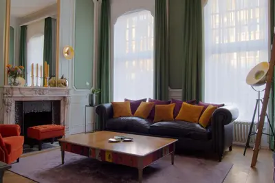 a living room with a couch and a coffee table at The Old Beech in Antwerp