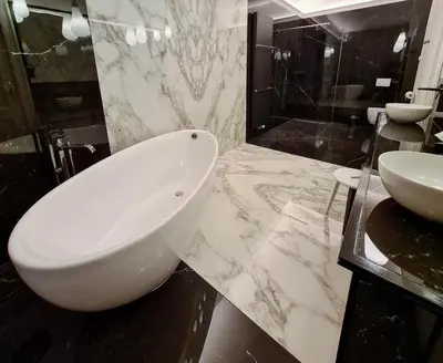a bathroom with a white tub and a sink at The Old Beech in Antwerp
