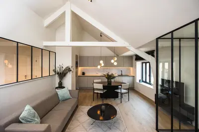 a living room with a couch and a table at The lodge Morris in Leuven