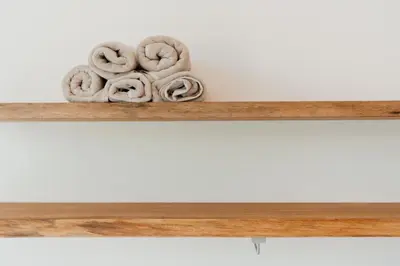 a pile of pretzels on a wooden shelf at LXRYHOME Pendennis Castle in Brasschaat