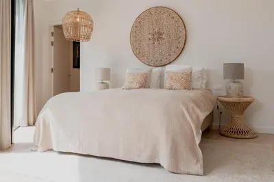 a white bedroom with a large bed with pillows at LXRYHOME Pendennis Castle in Brasschaat