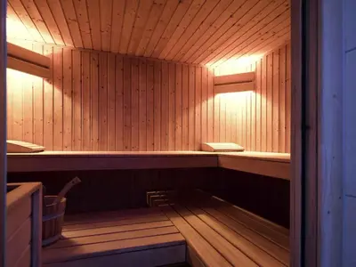 a sauna with a bench in the middle of it at Mercure Hotel Brussels Centre Midi in Brussels