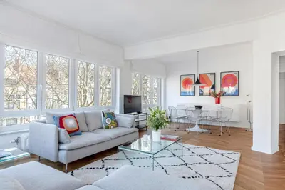 a living room with a couch and a table at Molière Design Residence in Brussels