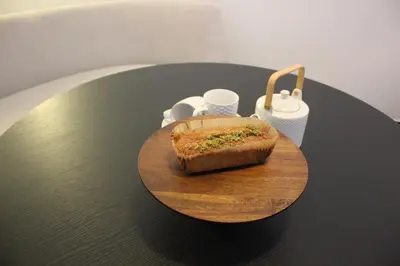 a sandwich on a cutting board on a table at Maison Gand in Ghent