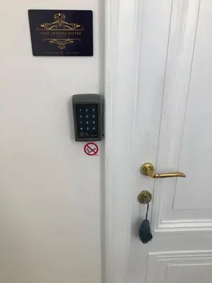 a door with a remote control attached to it at Sint Andries Suites in Antwerp