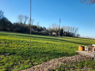 a picnic table in a field with trees at Kromven On Wheels in Merksplas