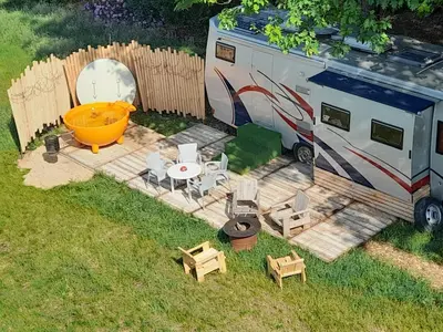 an aerial view of an rv and a table and chairs at Kromven On Wheels in Merksplas