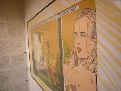 a large painting of a woman on a wall at Au Bout du Jardin in Waterloo