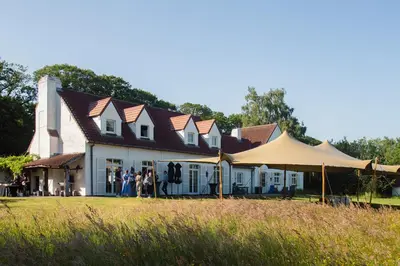 a group of people standing in front of a house at Villa Parkbos in De Pinte