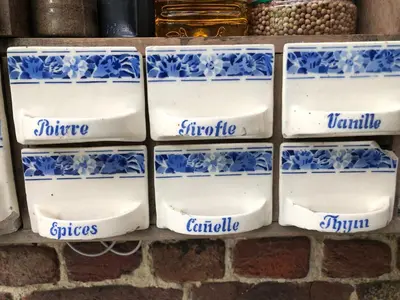 a group of blue and white plates on a brick wall at B&B Vennehoeve in Vremde