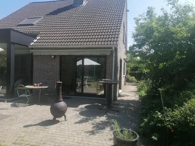 a large vase sitting outside of a house at villa in Kontich