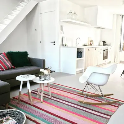 a living room with a couch and a table at Bright City Design House! in Antwerp