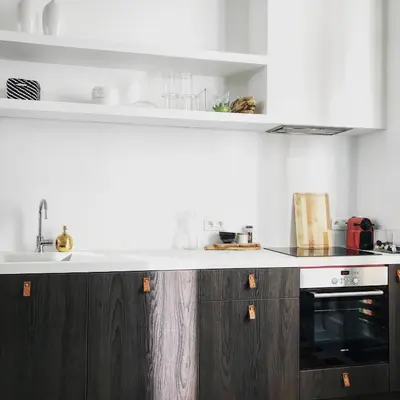 a kitchen with brown cabinets and a white counter top at Bright City Design House! in Antwerp
