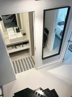a bathroom with a mirror and a sink at Bright City Design House! in Antwerp