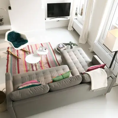 a living room with a gray couch with pillows at Bright City Design House! in Antwerp