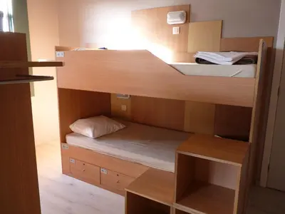 a room with two bunk beds in a room at Sleep Well Youth Hostel in Brussels