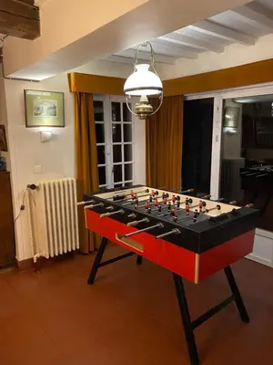 a foosball table in the middle of a room at Les Barolins in Rotselaar