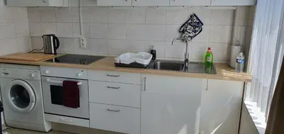 a kitchen with a sink and a washing machine at SUPERB APPARTEMENT WITH 3 BED ROOMS IN ANTWERPEN in Antwerp