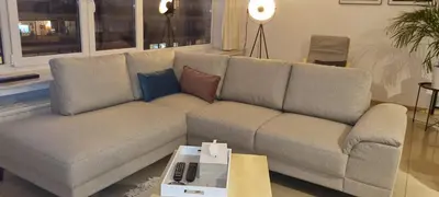 a living room with a couch and a table at SUPERB APPARTEMENT WITH 3 BED ROOMS IN ANTWERPEN in Antwerp