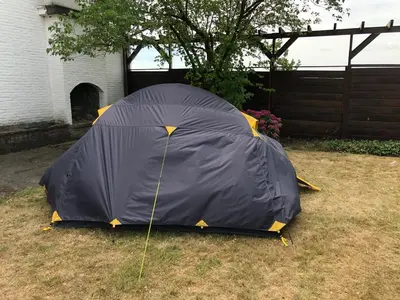 a black tent sitting on the grass in a yard at Tents @ Tomorrowland in Rumst