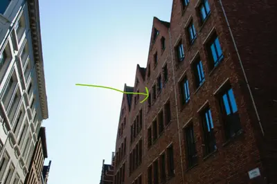 a kite flying in front of a brick building at Historical center Antwerp, all on foot in Antwerp