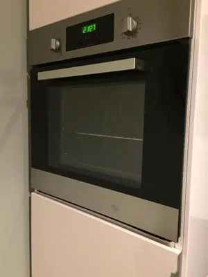 a microwave oven sitting on top of a refrigerator at BnB Antwerpen - CHARMANT in Antwerp
