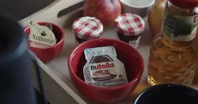 a table with a box of nutella and apples on a counter at Berkies - autonome studio in Steenokkerzeel