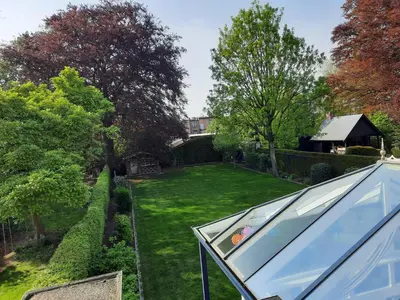an aerial view of a garden with a glass roof at On our way to Antwerp, first stop in Mortsel