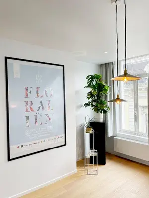 a living room with a picture on the wall at Jacob’s Getaway in Ghent
