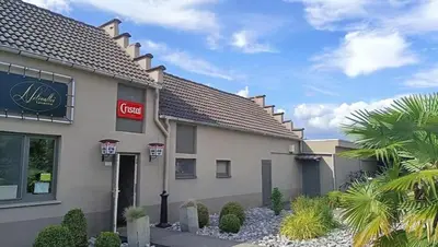 a mcdonalds building with a sign on it at Le Canard - Rust aan het water in Geel