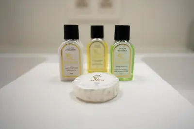 a group of three bottles of moisturizers on a counter at White Box in Gierle