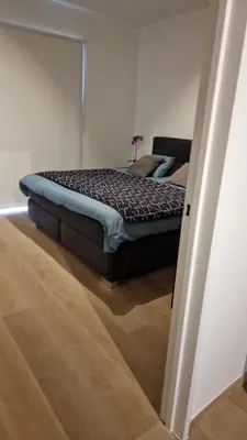 a bedroom with a bed in a room at Gezellig appartement Beveren Kruibeke Zwijndrecht Donkvijver in Beveren