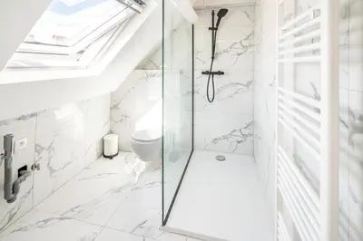 a bathroom with a shower and a toilet at Charming Central Cityflats in Antwerp