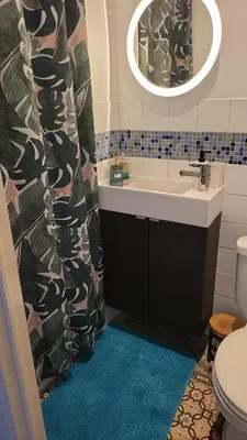 a bathroom with a sink and a toilet and a mirror at Cozy studio close to Zaventem Airport in Brussels