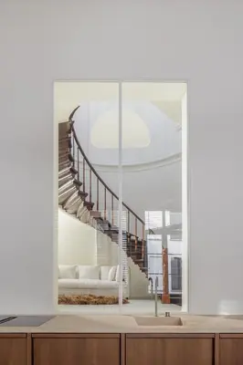 a living room with a staircase through a window at LuxuryApartmentSoulforCity in Ghent