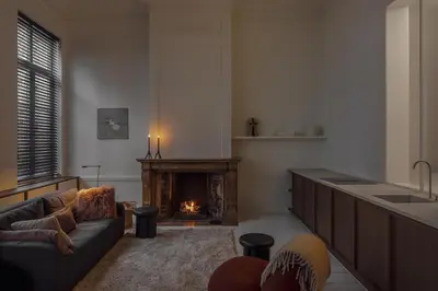 a living room with a couch and a fireplace at LuxuryApartmentSoulforCity in Ghent