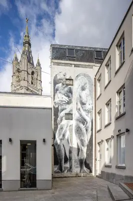 a mural of two men on the side of a building at LuxuryApartmentSoulforCity in Ghent