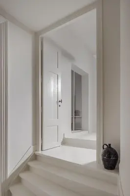 a white hallway with a mirror on the wall at LuxuryApartmentSoulforCity in Ghent