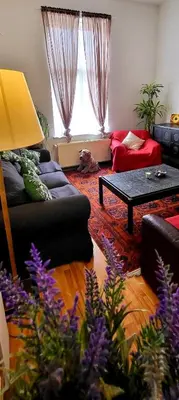a living room with a couch and a table at Bright studio close to Zaventem airport in Brussels