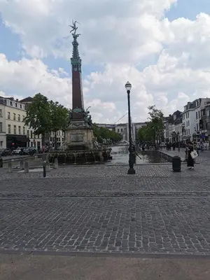 a monument in the middle of a street with a tower at Exclusive two-level apartment with private terrace on the canal Brussels in Brussels