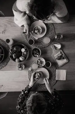 a group of people sitting at a table with food at KROOST in Lokeren