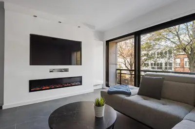 a living room with a couch and a fireplace at Lappertemento in Willebroek