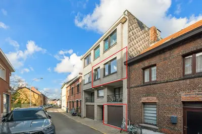 a car parked on a street next to a brick building at Lappertemento in Willebroek
