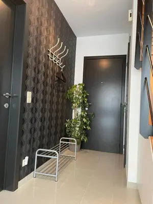 a hallway with a chair in front of a door at Casa Christel in Mechelen