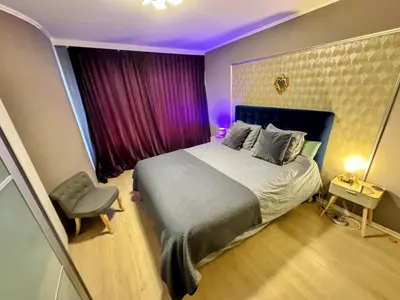 a bedroom with a large bed and a purple ceiling at Hearth of Brussels Gateway in Brussels