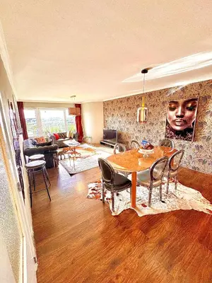 a living room with a table and chairs at Hearth of Brussels Gateway in Brussels