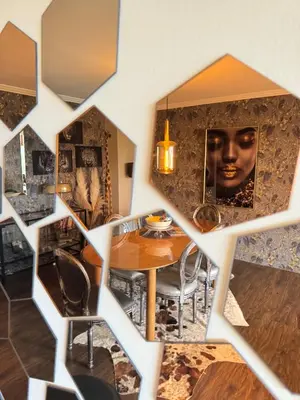 a dining room with a table and a face on the wall at Hearth of Brussels Gateway in Brussels