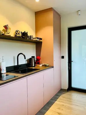 a kitchen with a sink and a counter at Via Caput in Lokeren