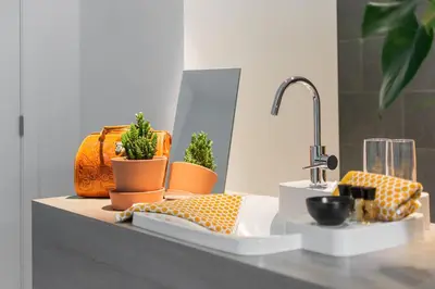 a kitchen counter with a sink and potted plants at Marcel de Gand Business & Travel in Ghent
