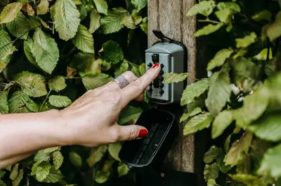 a person with a ring pressing a light switch at Marcel de Gand Business & Travel in Ghent